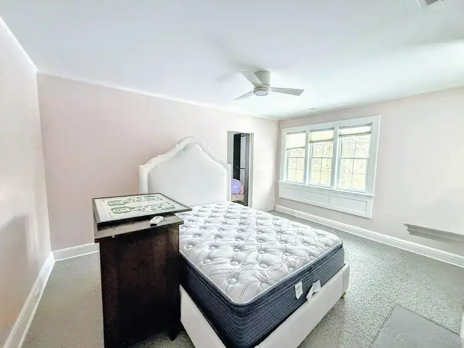 Bedroom with soft blush-grey painted walls