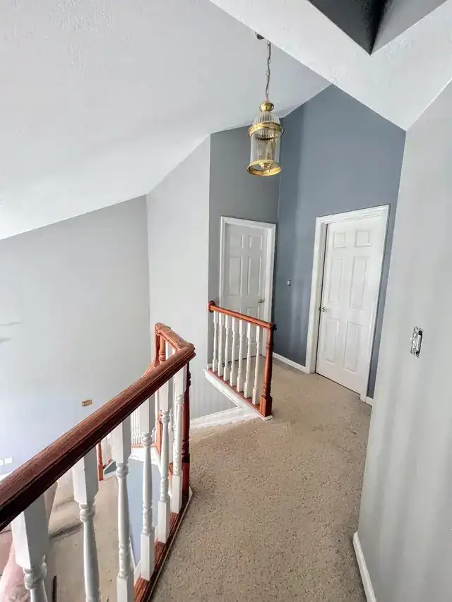 Upstairs landing with grey-blue painted walls
